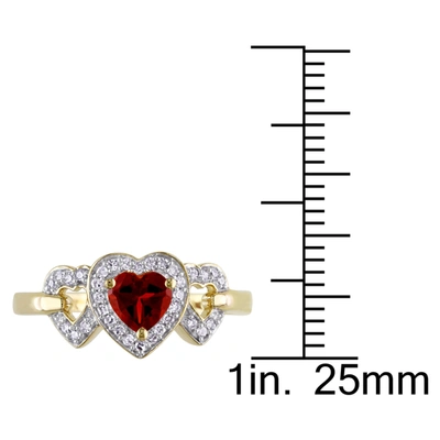 Mimi & Max Garnet Triple Heart Ring With 1/8 Ct Tw Diamonds In 10k Yellow Gold In Red