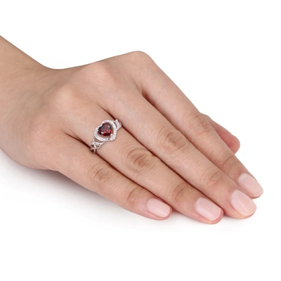 Mimi & Max 1/10 Ct Tw Diamond And Garnet Open Heart Crossover Ring In Sterling Silver In Red