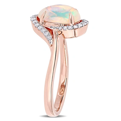 Mimi & Max 1 Ct Tgw Ethiopian Blue Opal And 1/7 Ct Tw Diamond Oval Halo Twist Ring In 10k Rose Gold In Multi