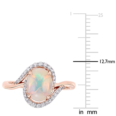 Mimi & Max 1 Ct Tgw Ethiopian Blue Opal And 1/7 Ct Tw Diamond Oval Halo Twist Ring In 10k Rose Gold In Multi