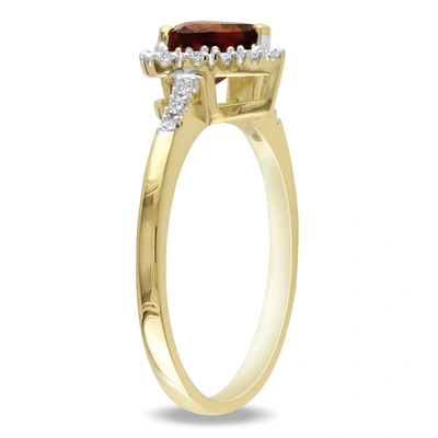 Mimi & Max Halo Heart Shaped Garnet Ring With 1/10 Ct Tw Diamonds In 10k Yellow Gold In Red