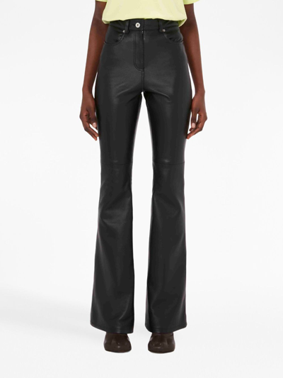 Shop Jw Anderson Four-pocket Leather Flared Trousers In Black