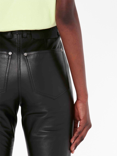 Shop Jw Anderson Four-pocket Leather Flared Trousers In Black