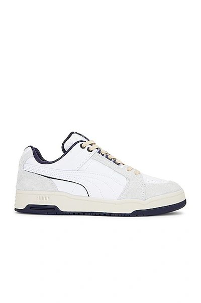 Shop Puma Slipstream Low Baseline Sneaker In White