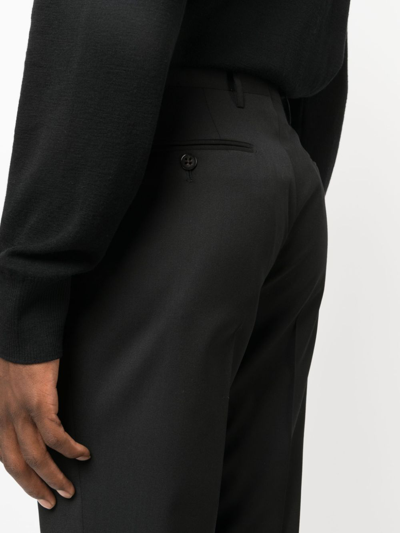 Shop Corneliani Slim-cut Virgin-wool Trousers In Black