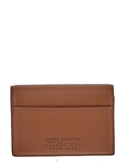 Shop Marc Jacobs Logo Embossed Small Bifold Wallet In Brown