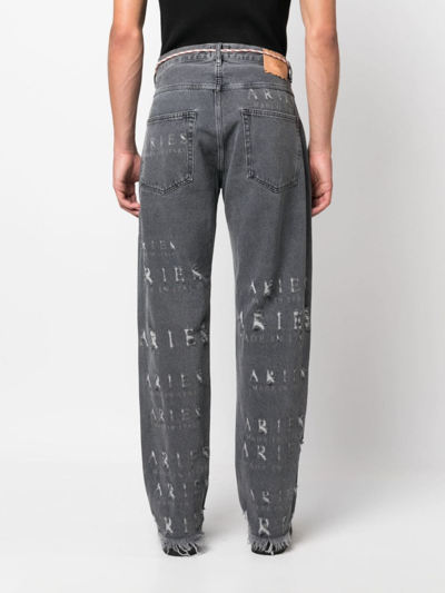 Shop Aries Destroyed Batten Logo-embellished Jeans In 黑色