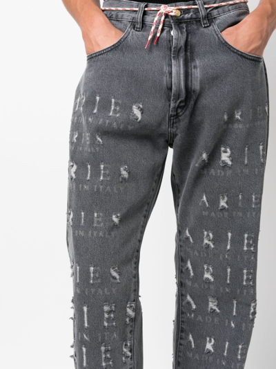 Shop Aries Destroyed Batten Logo-embellished Jeans In 黑色