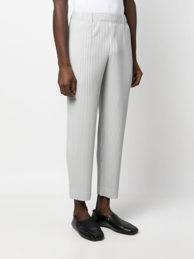 Shop Issey Miyake Low-rise Pleated Cropped Trousers In 灰色