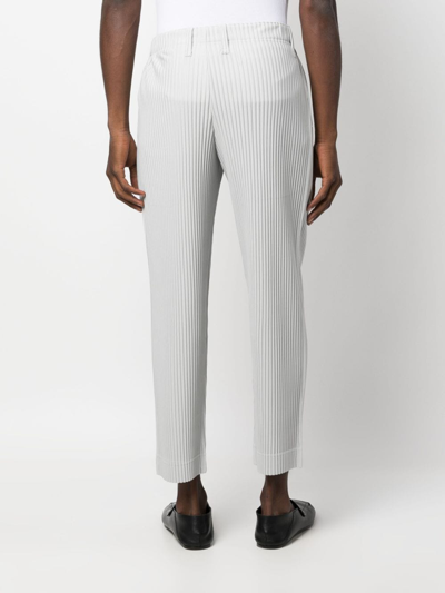 Shop Issey Miyake Low-rise Pleated Cropped Trousers In 灰色
