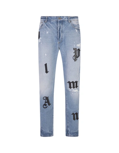 Shop Palm Angels Jeans With Logo Patches In Blue