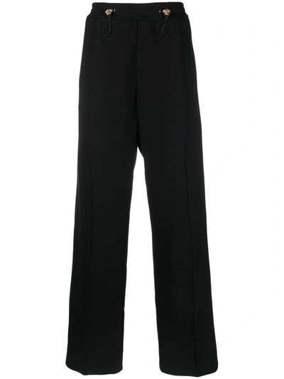 Shop Versace Medusa-embellished Pants In Black