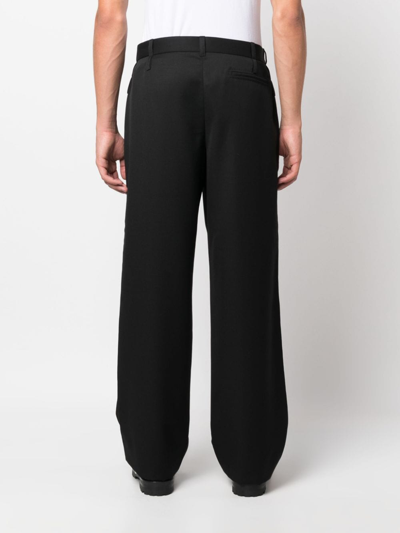 Shop Jacquemus Piccini Virgin Wool Trousers In Black