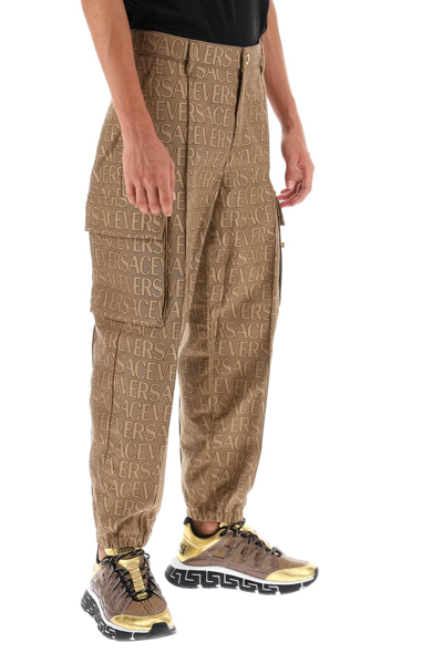 Shop Versace Allover Cargo Pants In Brown