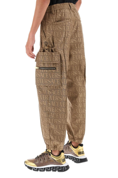 Shop Versace Allover Cargo Pants In Brown
