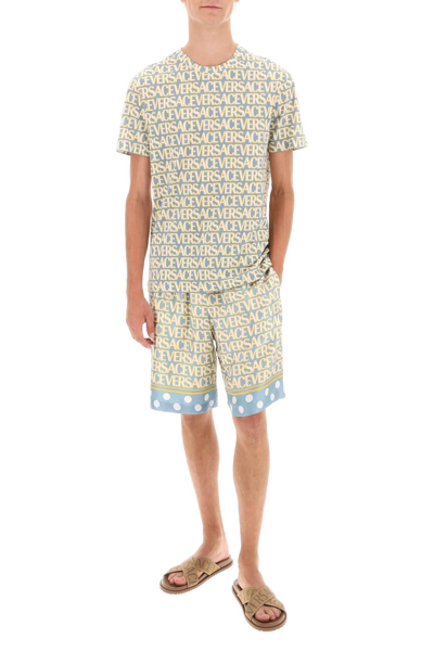 Versace Silk Bermuda Shorts With All-over Logo In Light Blue,yellow,white