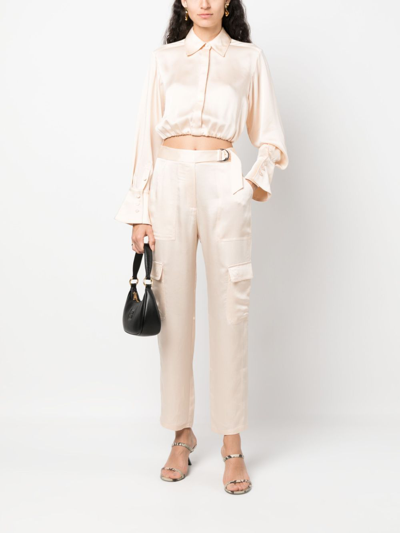 Shop Simkhai Satin-finish Cropped Trousers In Nude