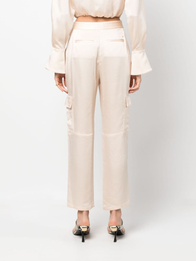 Shop Simkhai Satin-finish Cropped Trousers In Nude