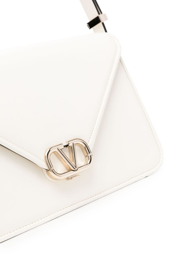 Shop Valentino Letter Leather Crossbody Bag In Nude