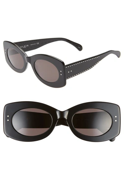 Shop Alaïa 51mm Oval Sunglasses In Black