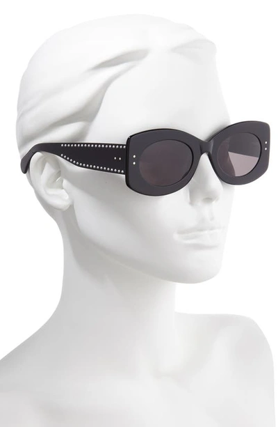 Shop Alaïa 51mm Oval Sunglasses In Black