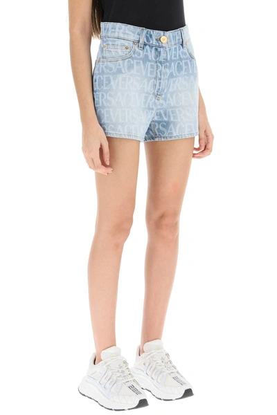 Shop Versace Logo Denim Shorts