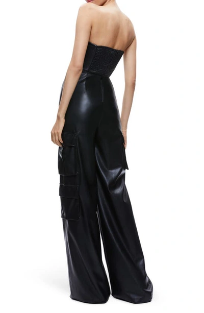 Shop Alice And Olivia Emelda Strapless Faux Leather Cargo Jumpsuit In Black