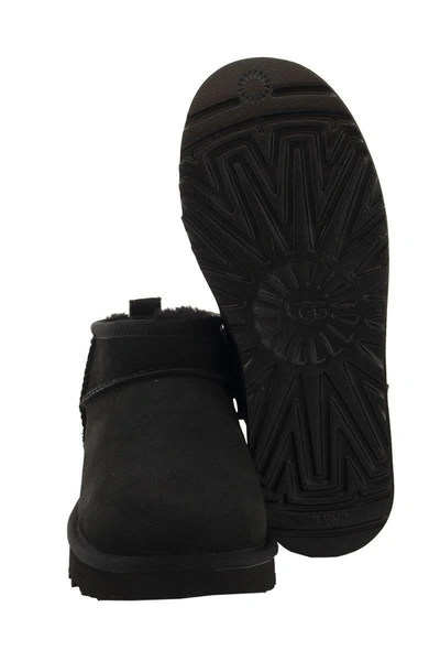 Shop Ugg Classic Ultra Mini - Sheepskin Boot In Black