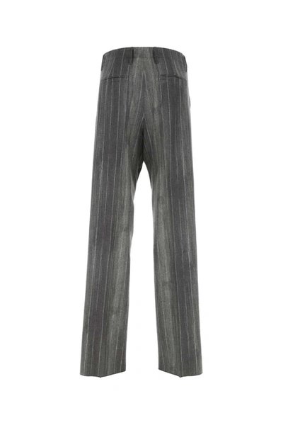 Shop Versace Pants In Stripped