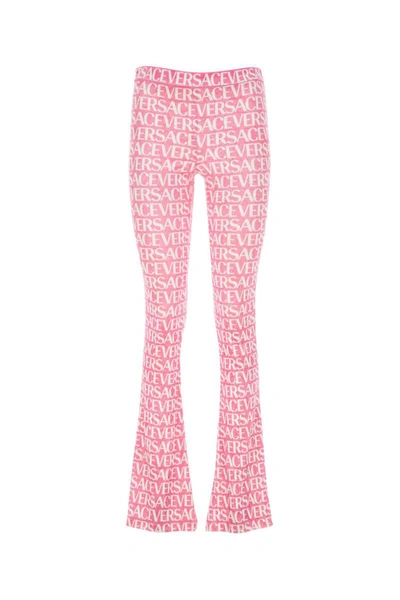 Shop Versace Pants In Printed