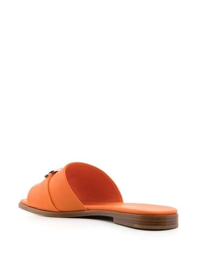 Shop Ferragamo Gancini Leather Flat Sandals In Brown