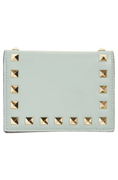 Shop Valentino Small Rockstud Leather French Wallet In W32 Water Green