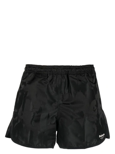 Shop Alexander Mcqueen Logo Swim Shorts In Black