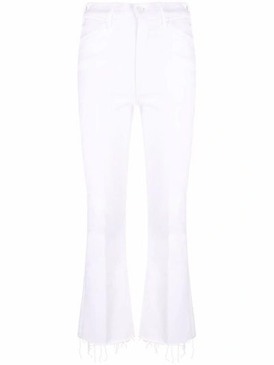 Shop Mother Flared Ankle Denim Jeans In White