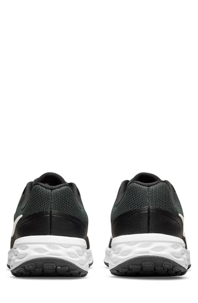 Shop Nike Kids' Revolution 6 Sneaker In Black/ White
