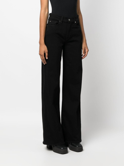 Shop 7 For All Mankind Lotta Soho Night High-rise Flared Jeans In Schwarz