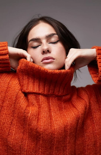 Shop Topshop Turtleneck Rib Sweater In Orange