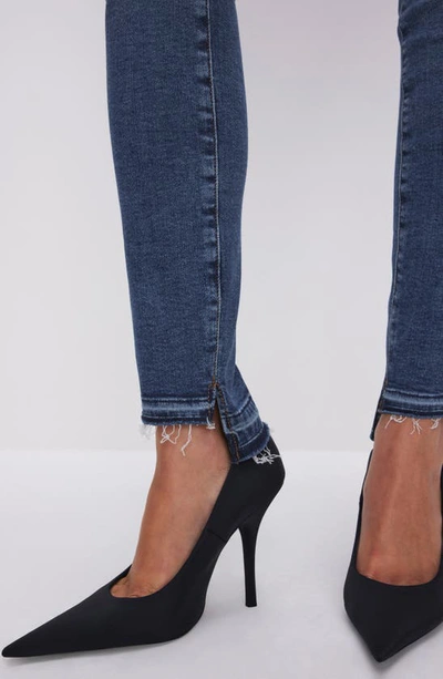 Shop Good American Good Legs Release Hem High Waist Skinny Jeans In Indigo502