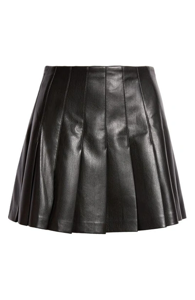 Shop Alice And Olivia Carter Pleated Faux Leather Miniskirt In Black