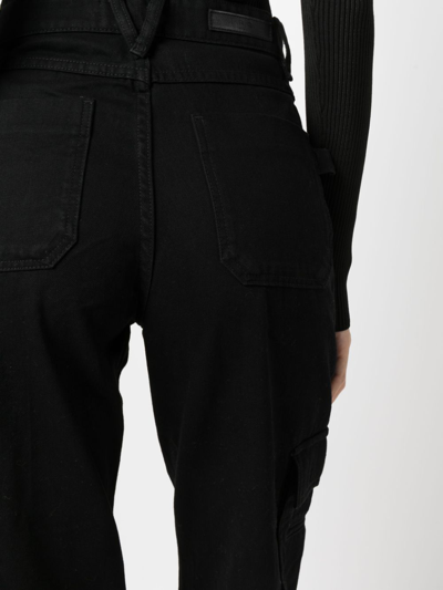 Shop Iro Flared-leg Cargo Jeans In Black