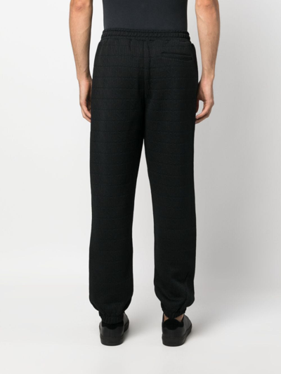 Moschino Logo-pattern Elasticated-waistband Track Pants In Schwarz