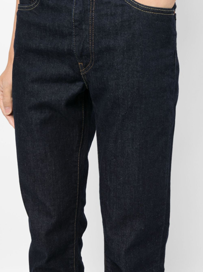 Shop Levi's Mid-rise Slim-fit Jeans In Blue