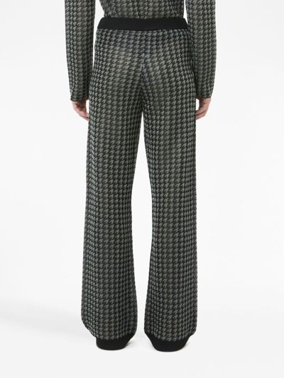 Jw Anderson Check-pattern Logo-plaque Trousers In Schwarz