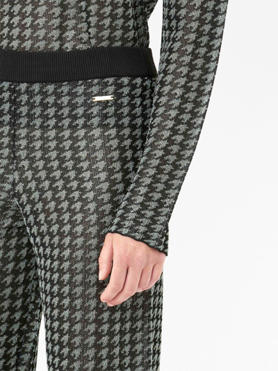 Shop Jw Anderson Check-pattern Logo-plaque Trousers In Schwarz