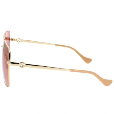 Shop Gucci Eyewear Sunglasses In Gold