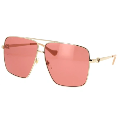 Shop Gucci Eyewear Sunglasses In Gold