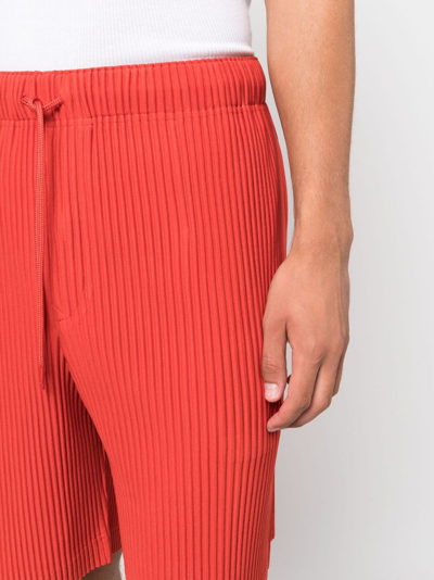 Shop Issey Miyake Low-rise Drawstring Pleated Shorts In Red