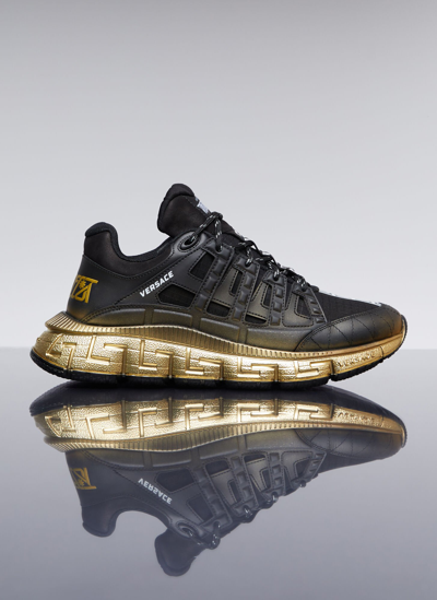 Shop Versace Trigreca Sneakers In Gold