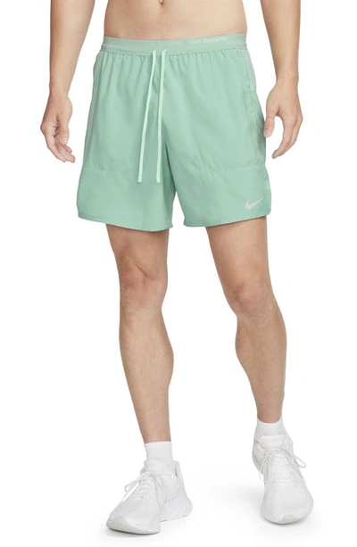 Shop Nike Dri-fit Stride 2-in-1 Running Shorts In Mineral/ Mica Green/ Jade Ice