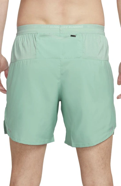 Shop Nike Dri-fit Stride 2-in-1 Running Shorts In Mineral/ Mica Green/ Jade Ice